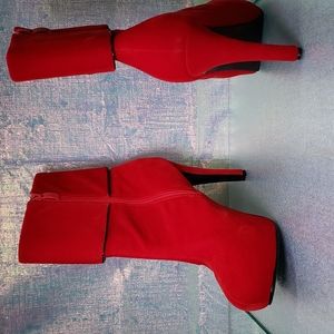 Red heeled velvet boots.